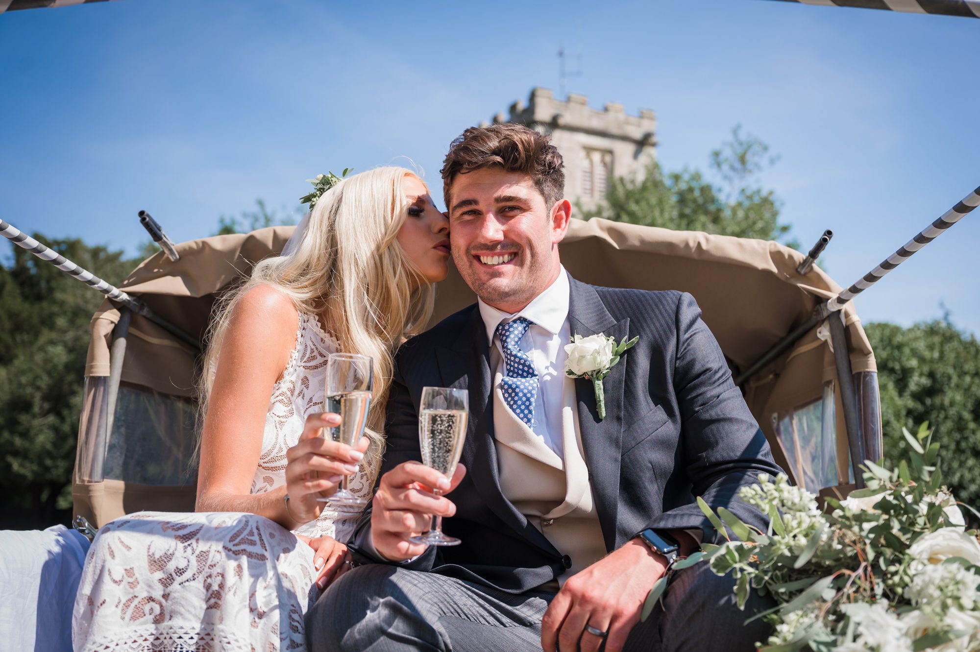 Yorkshire wedding photographer, Bride and groom in the back of a land rover posing