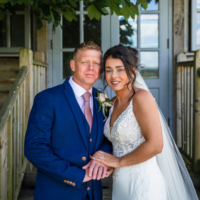 Yorkshire wedding photographer - bride and groom posing for camera , hornington manor