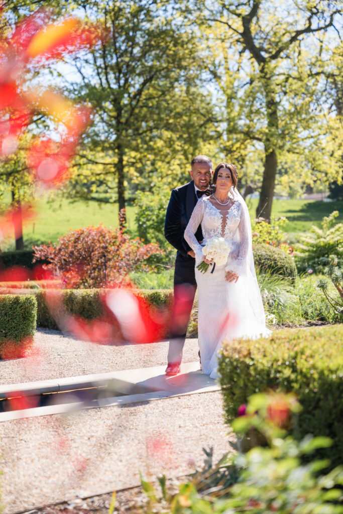 Bride & Groom posing in the garden at Grantley Hall